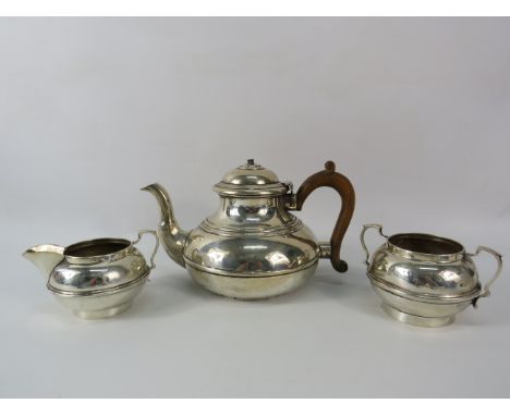 Hallmarked London c1922 Sterling silver teapot, sugar bowl and milk jug. Total weight 590 grams.