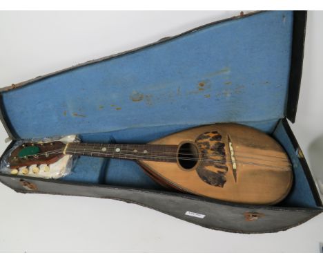 Vintage, Early 20th Century Mandolin, possibly by Carlo Ricordo with original Case. Interior label visable. Spare Strings. Be