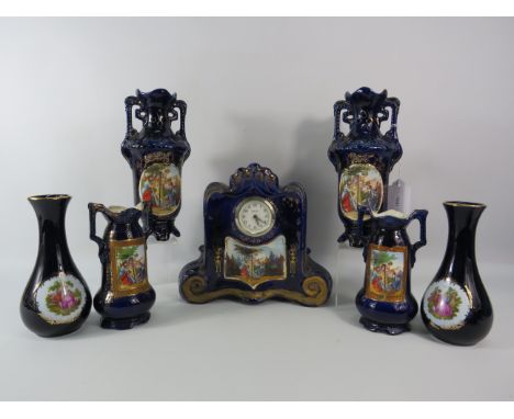 Vintage Austrian porcelain clock with matching vases plus two Limoges vases.