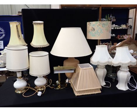 A BRASS DESK LAMP together with a collection of other lamps and shades