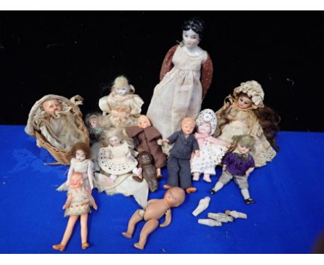 A COLLECTION OF SMALL AND MINIATURE DOLLS in bisque and others, 19th century and later, including some tiny 'pudding dolls'