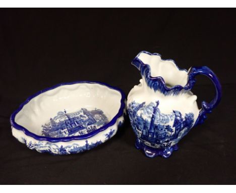 A MODERN BLUE AND WHITE POTTERY WASH JUG AND BASIN of 19th Century style, the jug 31cm high 