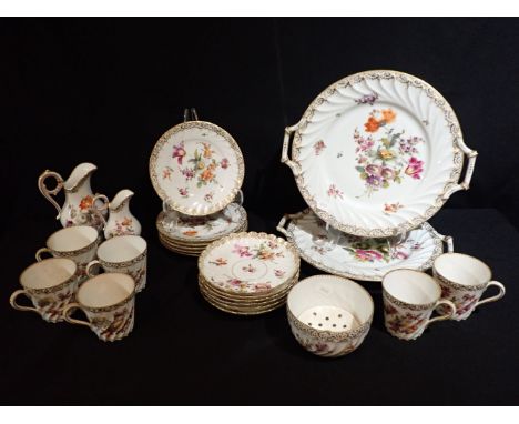 A DRESDEN PORCELAIN TEA SERVICE OF 18TH CENTURY STYLE enamelled with floral sprays within gilt rims comprising six tea cups, 