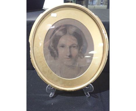 A PORTRAIT OF A LADY early 19th century, pastel in oval frame, height 44 cms 