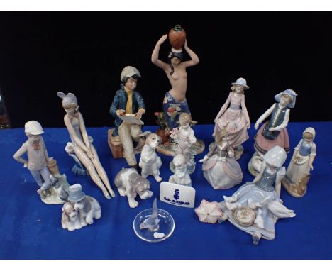 A LALIQUE RING HOLDER AND A QUANTITY OF LLADRO AND NAO FIGURES including a Nadal water carrier