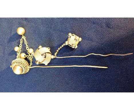 TWO 19TH CENTURY GILT METAL CLOAK OR HAIR PINS with ball decoration 14cm and 16cm long