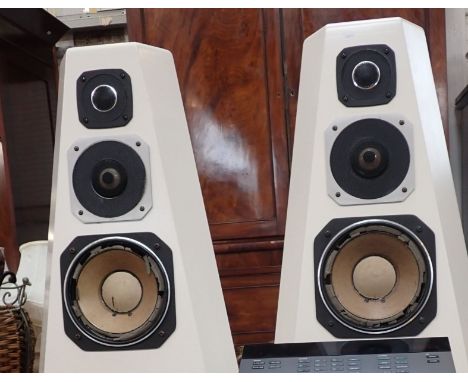 A PAIR OF WHITE BOLLARD SHAPED SPEAKERS 82cms high