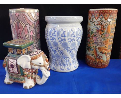 A CHINESE BLUE AND WHITE GARDEN SEAT (modern), a small elephant stand and two cylindrical stick stands (4)