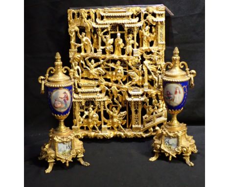 A PAIR OF GILT METAL AND PORCELAIN GARNITURE of classical campagna urn form, on a stepped base to scroll feet, 32cm high, tog