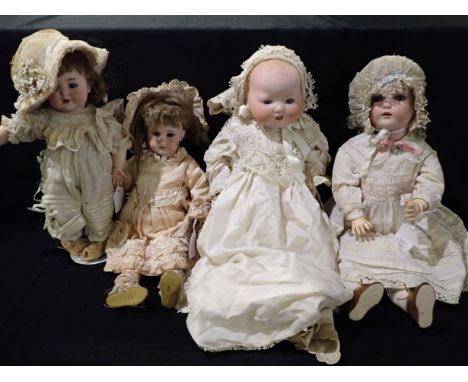 FOUR VARIOUS BISQUE HEAD DOLLS stamped AM, BP, DEP, 35 - 50cm high (4)