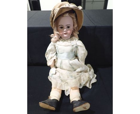 A LARGE BISQUE-HEAD DOLL stamped DEP 73cm high