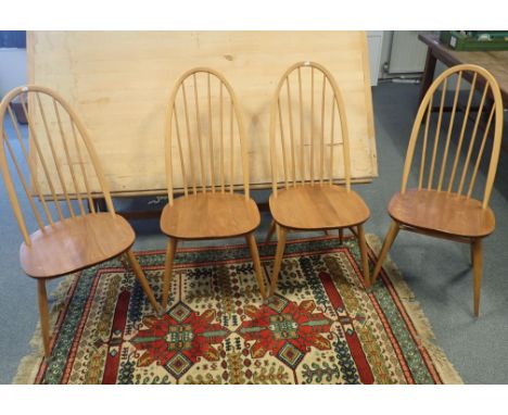 A SET OF FOUR ERCOL ELM HOOP BACK DINING CHAIRS 