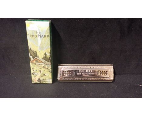 A HOHNER 'ECHO HARP' METAL REED HARMONICA in original box