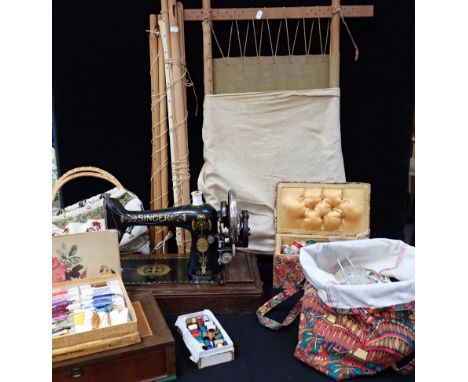 A SINGER SEWING MACHINE, WITH 'EGYPTIAN' DESIGN ENAMEL a tapestry frame, sewing requisites, cottons etc