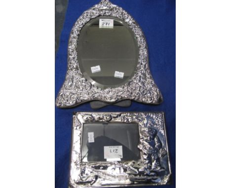 Silver repousse mounted photograph frame with humorous fishermen decoration, London hallmark, together with a silver foliate,