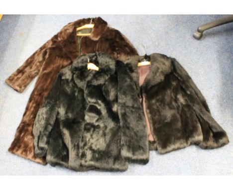 Two vintage rabbit fur jackets (one black, one dark brown), together with a dark brown 3/4 length fur coat. (3)(B.P. 24% incl