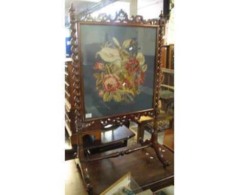 Victorian rosewood fire screen with pierced carvings, barley twist supports and floral tapestry insert.(B.P. 24% incl. VAT)
