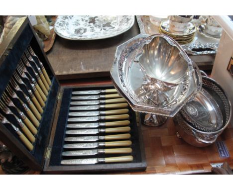 Tray of assorted silver plate to include: silver handled basket, cake stands, compote etc. Together with a cased knife and fo