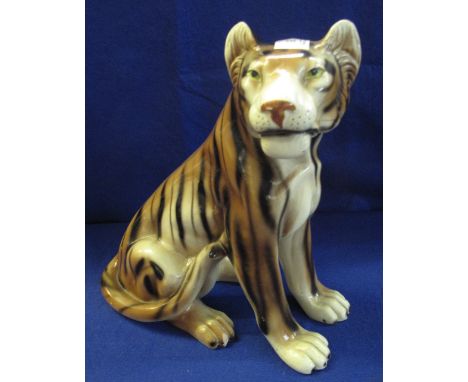 Ceramic fireside model of a seated tiger, 37cm high.(B.P. 24% incl. VAT)