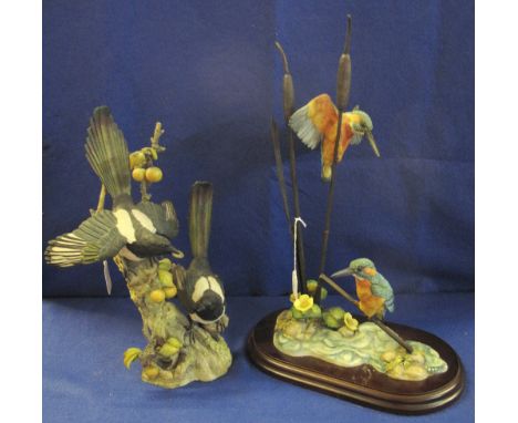 Two Teviotdale ceramic bird sculptures, pair of kingfishers on reeds and pair of magpies on stumps, labels to bases. 49cm and