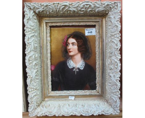 Porcelain plaque printed with portrait of a woman in 19th Century dress, cream foliate frame. (Care, loose in frame) (B.P. 24