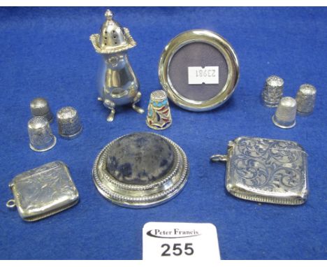 Tub of assorted small silver items, various, including: thimbles; Vesta cases; pepperette; photograph frame; pin cushion. (B.