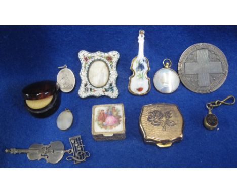 A collection of costume jewellery and silver including a micro mosaic picture frame, silver locket engraved with a penny fart