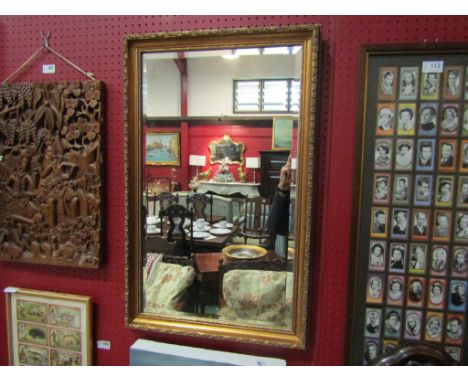 A modern gilt framed rectangular mirror with bevelled glass, 76cm x 49cm