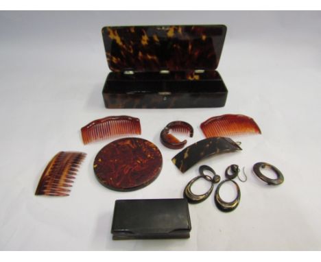 A tortoiseshell box with combs, earrings, a small tortoiseshell backed circler mirror, etc