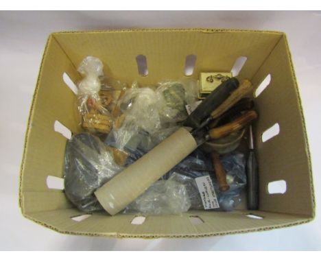 A box containing a selection of items including mantel clock, vintage hair curlers, shoe stretchers, Prattware pot, dolls hou