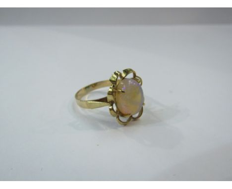 A gold ring set with large opal in open wavy mount stamped 375. Size P, 3.5g