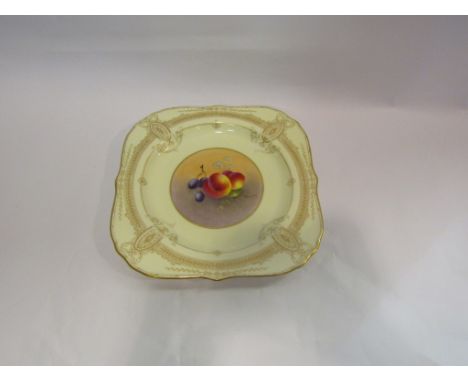 A Royal Worcester plate, hand-painted central panel depicting fruit signed by Townsend, 24cm wide