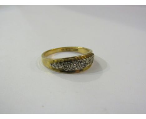 An 18ct gold ring set with white gold diamond set panel. Size O, 3.6g