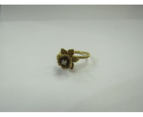 A gold "Daffodil" ring with diamond centre, stamped 14k. Size J, 2.8g