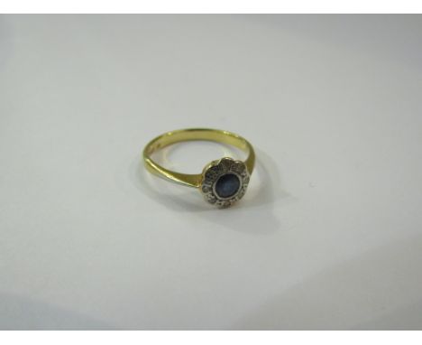 A gold sapphire and diamond flower ring, stamped 18ct. Size M, 2.1g