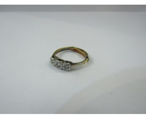 A gold ring set with three diamonds in illusion setting stamped 18ct, size O, 2.7g