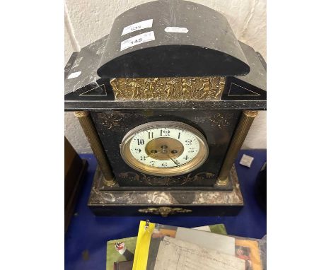 A black slate and marble and gilt trimmed mantel clock