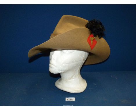 A British Military Slouch hat by W.A. Hatton, Atherstone 1943, for The Gurkha Rifles with black cockade and Kukri insignia.