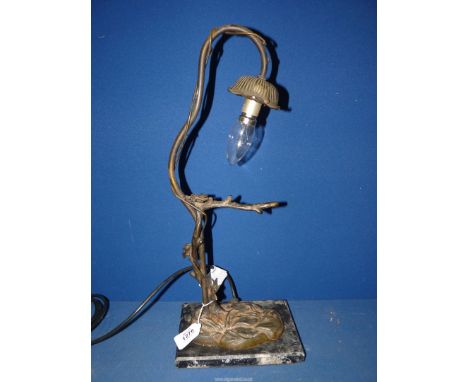 An Art Nouveau style table lamp with iron branch lamp holder and marble base, 19'' high overall.