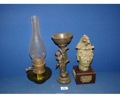 A carved head of Palenque Masa on plinth 28" tall, together with a cherub for flower arranging and an Oil Lamp (double burner
