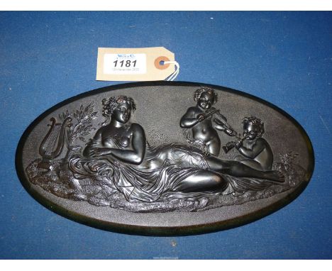 A late 19th c. ebonised Mahogany Plaque or furniture mount very finely carved with a scene of music. The muse reclines next t