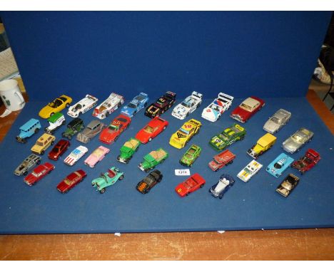 A quantity of Corgi and Matchbox model cars, racing cars, models of yesteryears, Coleman's Mustard etc., play worn.