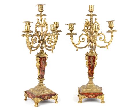 A PAIR OF FRENCH GILT-METAL 'BOULLE' FIVE-LIGHT CANDELABRA, 19TH CENTURY each with scrolling leaf-cast arms above a tapering 