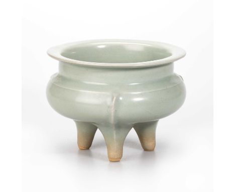 A LARGE CHINESE LONGQUAN CELADON TRIPOD CENSER with broad circular rim above a recessed frieze, the tapering legs with unglaz