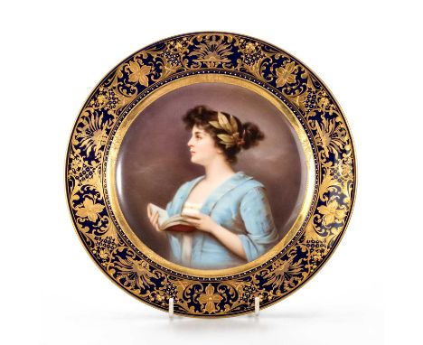 A VIENNA PORCELAIN PLATE, 19TH CENTURY painted with a titled portrait of a young lady, 'Poesie', signed, within an elaborate 
