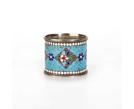 A RUSSIAN SILVER AND CLOISONNÉ ENAMEL NAPKIN RING First Kokoshnik marked, decorated with scrolls and flower heads, with picke