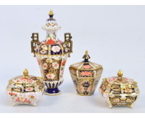 A small collection of Royal Crown Derby Imari pattern comprising a pair of shaped lidded dishes, a small hexagonal lidded pot