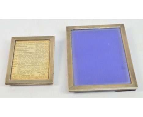 Two engine turned white metal rectangular photograph frames, each stamped "835", 21 x 15.75cm and 14.5 x 11.5cm (2).