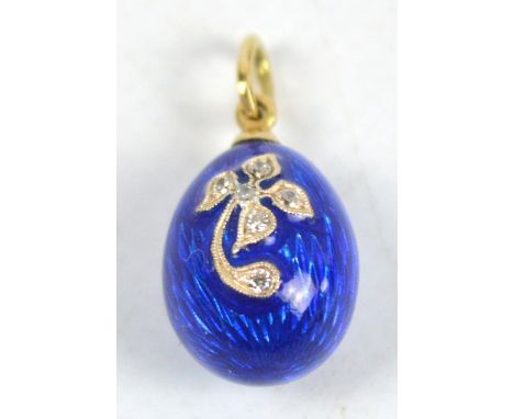 An 18ct yellow gold and blue guilloche enamel egg shaped pendant with floral decoration set with diamonds. CONDITION REPORT: 