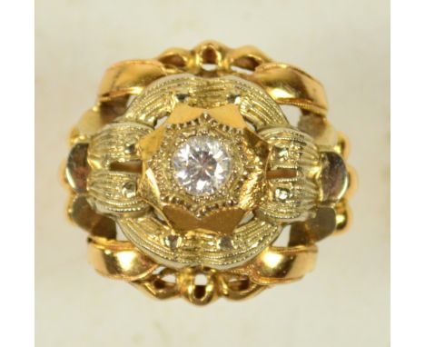 An Italian ornate single stone dress ring with pierced and scrolling surround, size O/P.